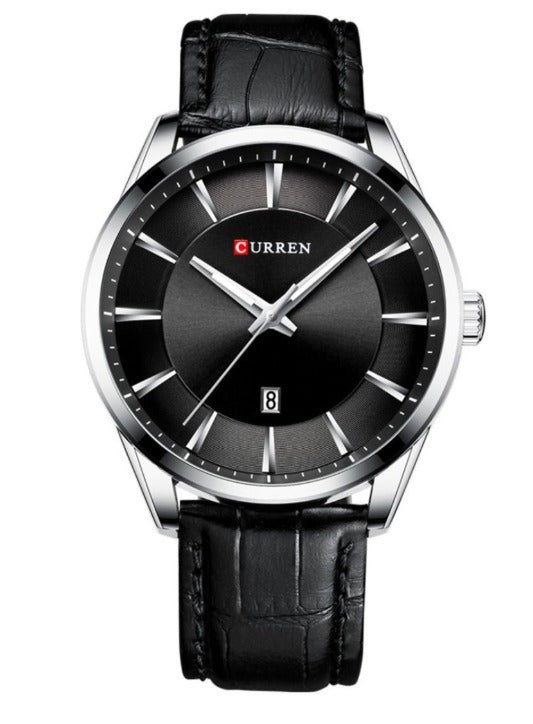 Black wristwatch with a silver case and black leather strap on a white background