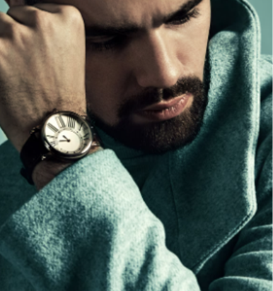 Man wearing a watch with a blurred background